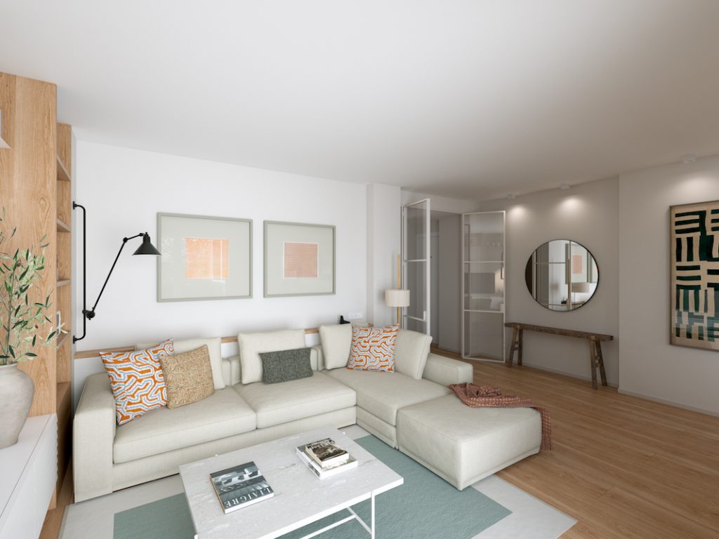 salón con sofá blanco y puerta abierta